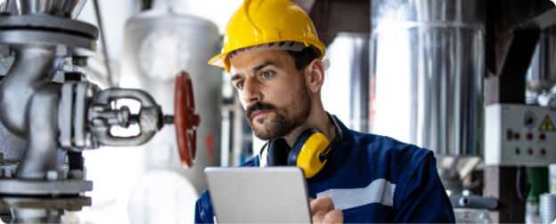  A technician reviewing a checklist for can-seamer machine maintenance