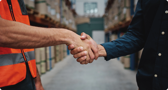 Employee and customer shaking hands